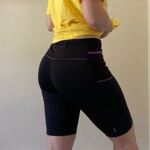 Athleta 9” Bike Shorts with Phone Pocket and Purple Accents